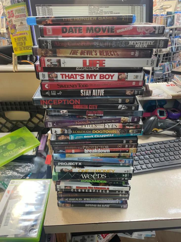 Shelves of pre-owned CDs and DVDs for sale at CD Exchange in Holland, MI